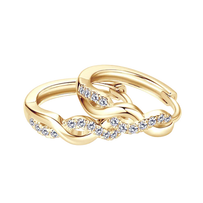 Gold earring with diamond accents on a white background