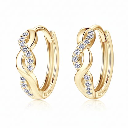 Gold hoop earrings with diamond accents on a white background